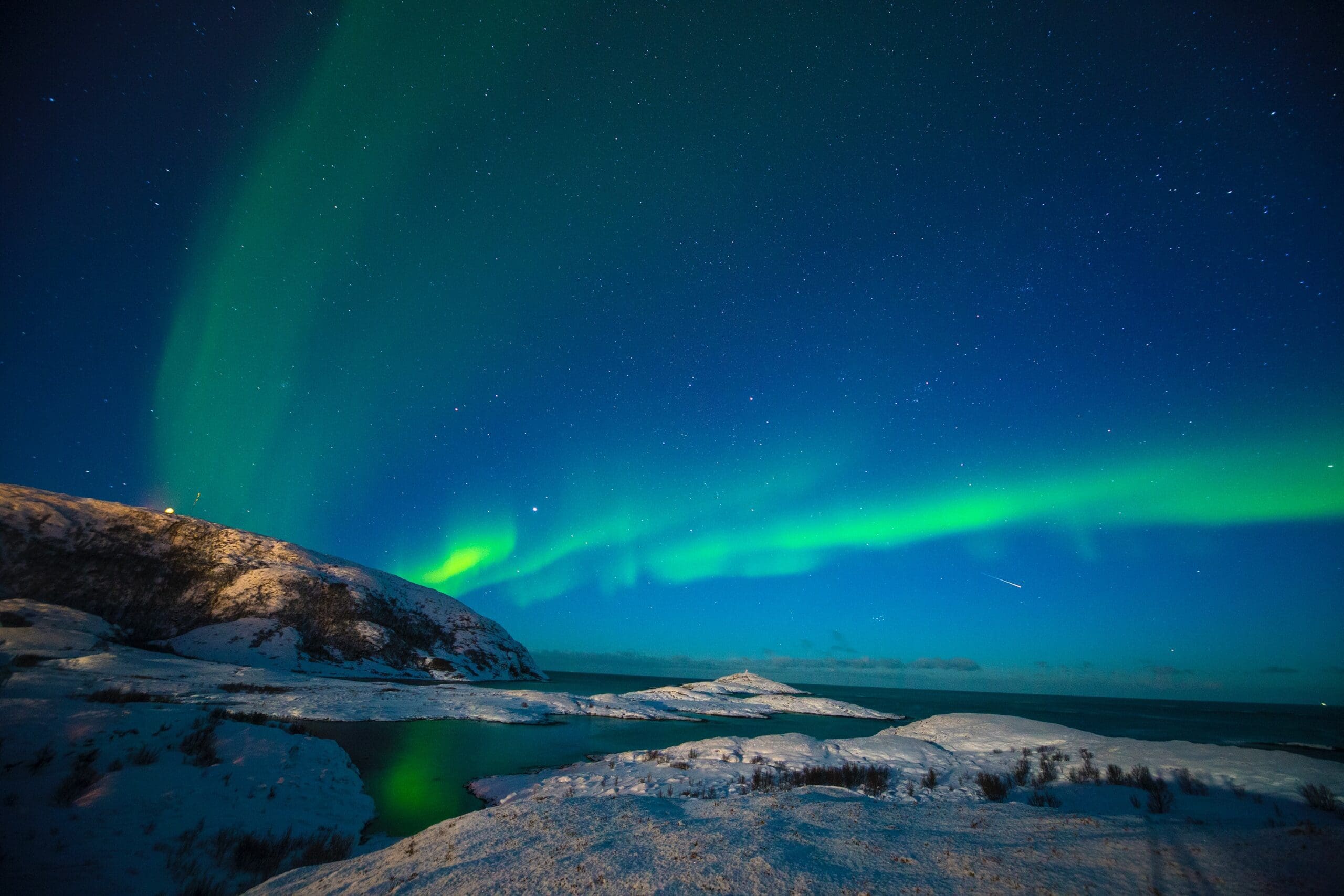 Image of snowy hills and northern lights